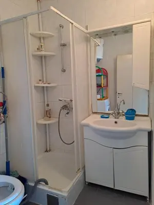 a bathroom with a shower and a sink and a sink at Villa Peonia in Sutomore
