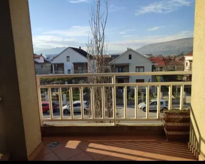 a balcony with a view of a parking lot at Honey Home in Podgorica