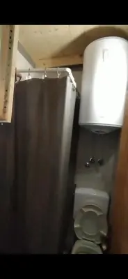 a bathroom with a toilet in a stall at Still cabin in Cetinje