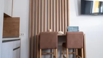 a kitchen with a table and two chairs at Viewpoint Villa in Budva