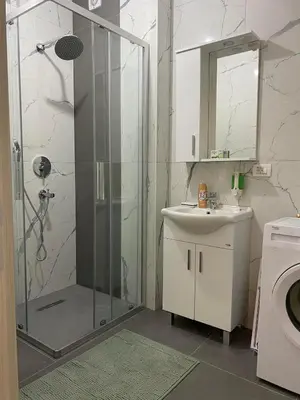 a bathroom with a shower and a sink and a toilet at Ulcinj Apartments in Ulcinj