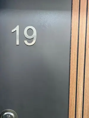 a door with the number on it at Ulcinj Apartments in Ulcinj