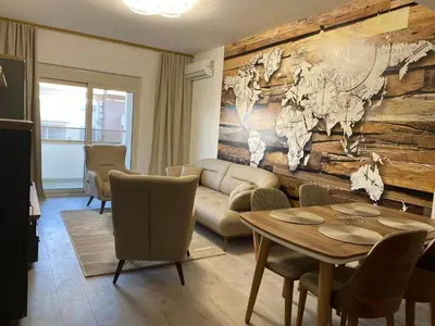 a living room with a couch and a table at Ulcinj Apartments in Ulcinj