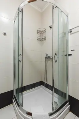 a shower with a glass enclosure in a bathroom at Studio apartment in the centre of Budva in Budva