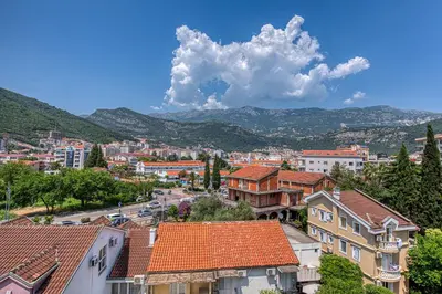a view of a city with mountains in the background at Studio apartment in the centre of Budva in Budva