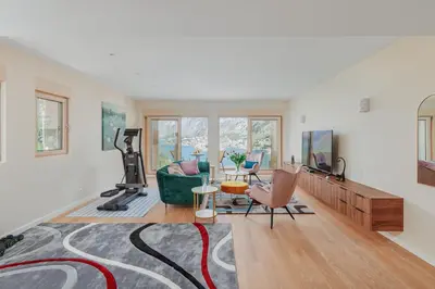 a living room with a couch and a tv at Huge Apartment with Stunning View and Sauna in Kotor