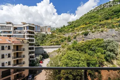 a view from a balcony of a building and a mountain at Aura Tower Aparments by In Property in Rafailovici