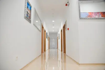 an empty hallway with white walls and a painting on the wall at Motel Celebic in Podgorica