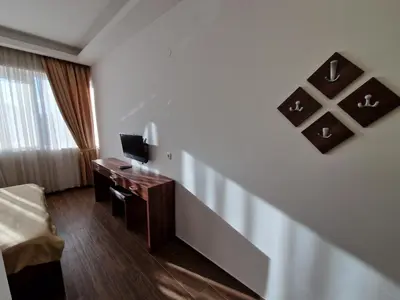 a hotel room with a desk with a computer on it at Motel Celebic in Podgorica