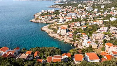 an aerial view of a town next to the water at Villa Maren in Utjeha