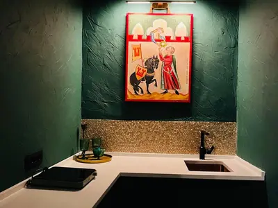 a bathroom with a sink and a picture on the wall at La Mia Amore in Kotor