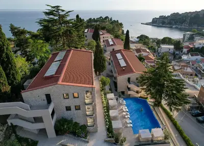 an aerial view of a house with a swimming pool at The New Hotel Mediteran - VILLA Edition in Ulcinj