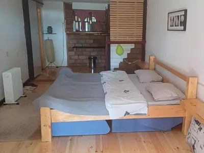 a bedroom with a large bed in a room at Cute lodge in Zeta in Mahala