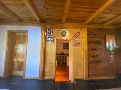 a hallway in a house with wooden ceilings at Cute lodge in Zeta in Mahala