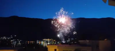 a firework display in the sky at night at Apartment OAZA in Kotor