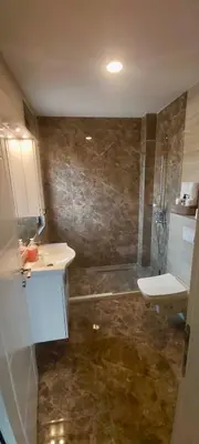 a bathroom with a sink and a toilet at Apartament Mehmeti in Ulcinj