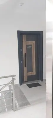 a door in a room with a table and a door at Apartament Mehmeti in Ulcinj