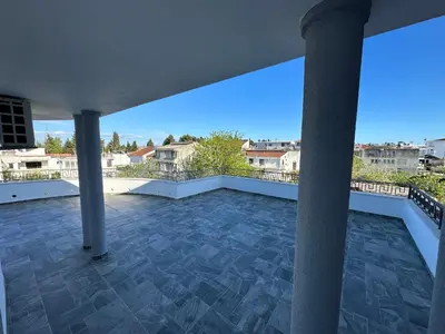 a large balcony with a view of a city at Apartments Near The Coast - Milla in Ulcinj