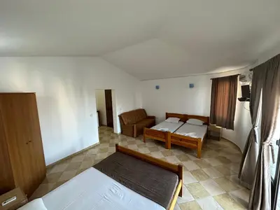 a small room with two beds and a couch at Apartments Near The Coast - Milla in Ulcinj