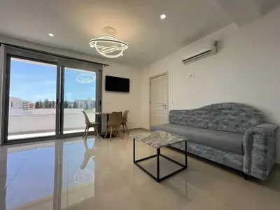 a living room with a couch and a table at Apartments Bojku in Ulcinj