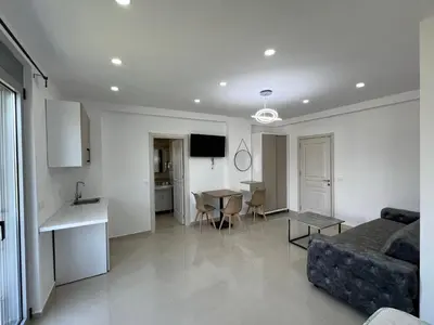 a living room with a couch and a table at Apartments Bojku in Ulcinj