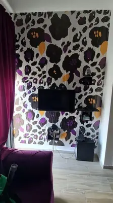 a room with a wall with a animal print wall at Cypress Alley Amazing Apartment in Ulcinj