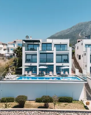a large white building with a swimming pool at Orange Villa - 7 Bedrooms - 5 Star Location - Views - Pool in Dobra Voda