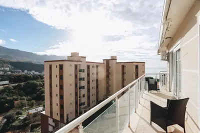 a balcony with a view of buildings at Status-M Apartments Sunny Side in Becici