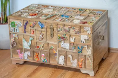 a wooden cabinet filled with lots of figurines at The view of Kotor - Sea & Old town view in Kotor