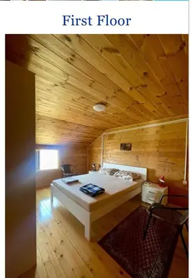 a bedroom with a bed in a wooden room at Krnic Kottage Ratac-Sutomore-Bar-Montenegro in Sutomore