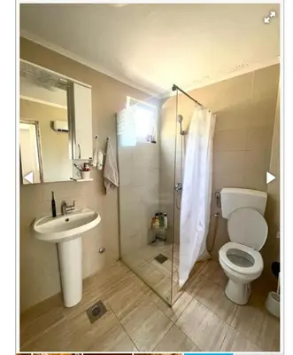 a bathroom with a toilet and a sink and a shower at Krnic Kottage Ratac-Sutomore-Bar-Montenegro in Sutomore