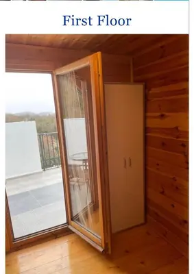 a first floor room with a door and a window at Krnic Kottage Ratac-Sutomore-Bar-Montenegro in Sutomore
