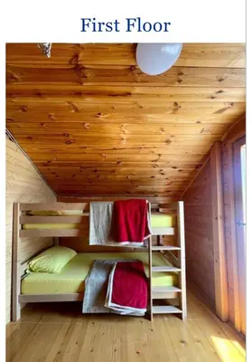 a bunk bed in a room with a wooden ceiling at Krnic Kottage Ratac-Sutomore-Bar-Montenegro in Sutomore
