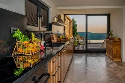 a kitchen with a counter with fruits and vegetables on it at Villa Di Campagna in Kotor