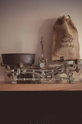 an old sewing machine sitting on a wooden table at Villa Di Campagna in Kotor