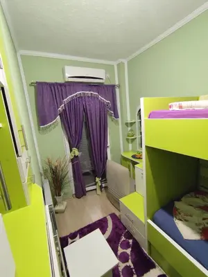 a room with two bunk beds and a window at Apollon home apartments in Bar