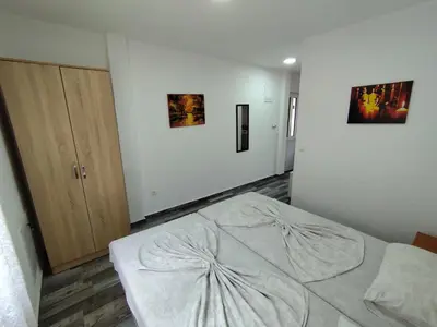 a bedroom with a large bed in a room at Apollon home apartments in Bar