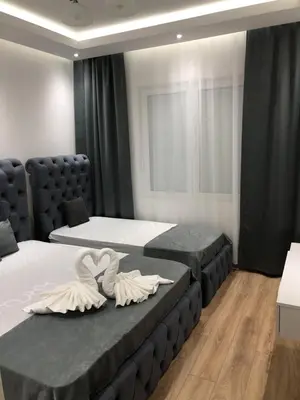 a bedroom with two beds and azeb at Apartments Long Beach in Ulcinj