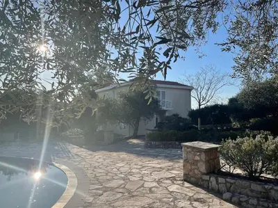 a house with a stone driveway in front of a house at Villa Thetis in Bigovo