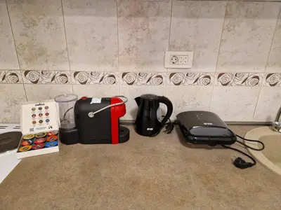 a kitchen counter with a coffee maker and a blender at Your place in Podgorica in Podgorica