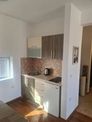 a kitchen with a sink and a counter top at Ulcinj apartman 