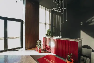 a room with a red partition with potted plants at Beachfront luxury apartment in Budva