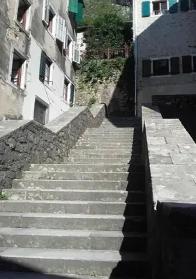 a set of stairs leading up to a building at Bond studios- Old town in Kotor