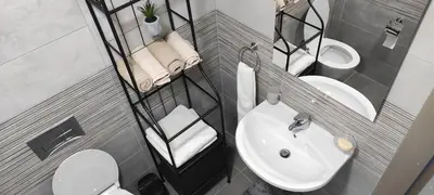 a small bathroom with a sink and a toilet at South Side Apartment in Podgorica