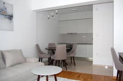 a living room with a couch and a table at Status-M Аpartments 133 in Becici