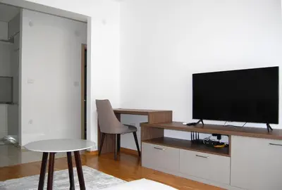 a living room with a flat screen tv on a entertainment center at Status-M Аpartments 133 in Becici