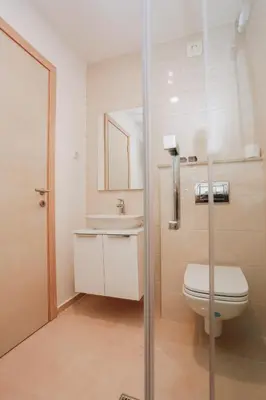 a bathroom with a toilet and a sink at Status-M Аpartments 133 in Becici