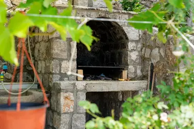 a brick oven with a fire inside of it at Villa 177 in Tivat