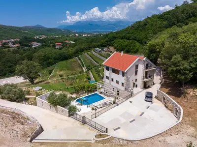 an aerial view of a house with a swimming pool at Villa 177 in Tivat