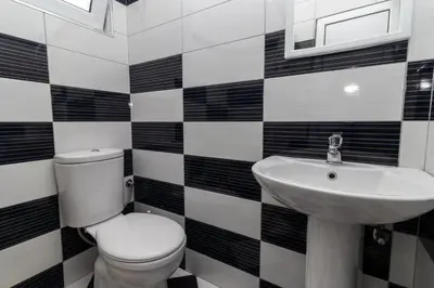a bathroom with a toilet and a sink at AS Apartments in Ulcinj